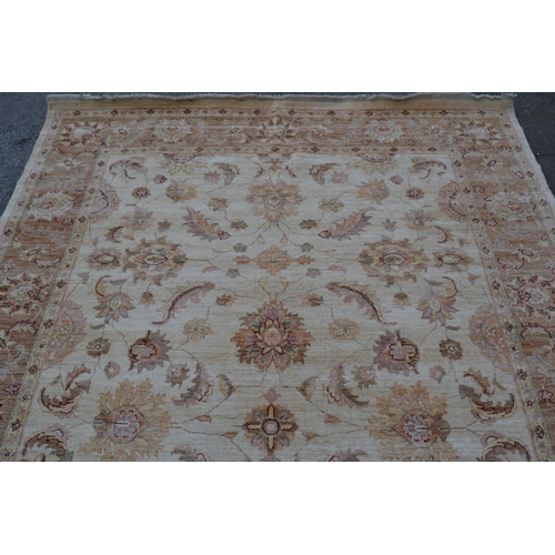 29 - Afghan carpet of Ziegler design with an all-over palmette pattern on an ivory ground with borders, 2... 