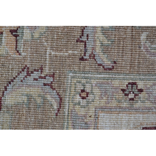 29 - Afghan carpet of Ziegler design with an all-over palmette pattern on an ivory ground with borders, 2... 