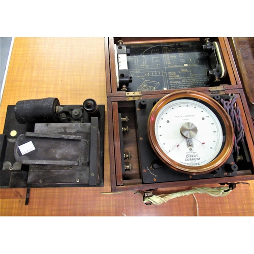 290 - Record Electrical Company large mahogany cased volts/ amps meter, together with a Schall & Son brass... 