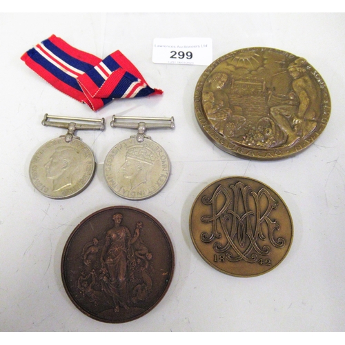 299 - Second World War, two medal group together with three bronze medallions