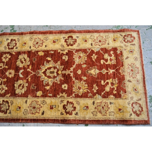 35 - Modern Afghan Ziegler design runner with a palmette and floral pattern on a rust ground with ivory b... 