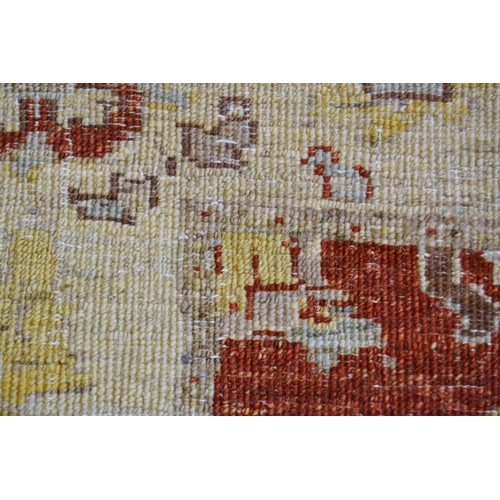 35 - Modern Afghan Ziegler design runner with a palmette and floral pattern on a rust ground with ivory b... 