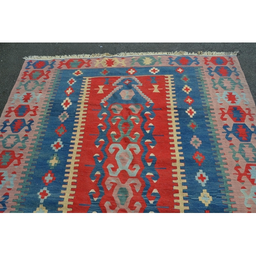 36 - Kelim rug in shades of red, blue, pink and beige, 250cms x 186cms