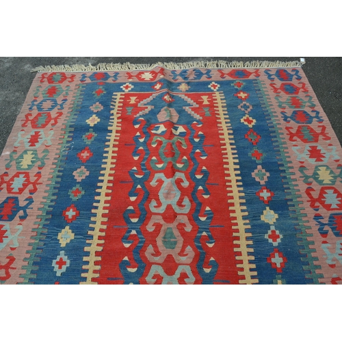 36 - Kelim rug in shades of red, blue, pink and beige, 250cms x 186cms