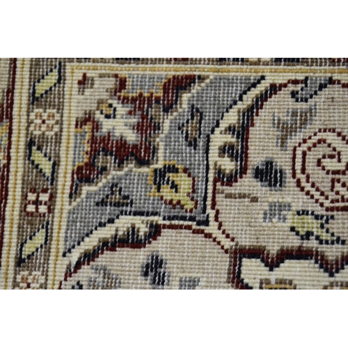 37 - Small Pakistan rug of Persian design with a medallion and floral all-over pattern on a navy ground w... 