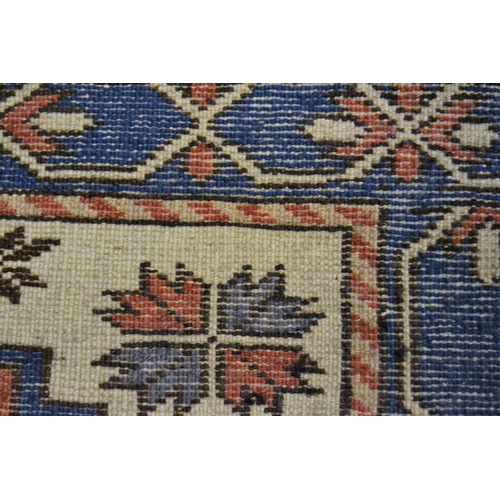 39 - Small Turkish rug of Caucasian design with a triple medallion in shades of blue, rose and ivory, 165... 