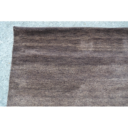 47 - Modern Indian Gabbeh design rug in plain mottled dark tan, 150cms x 240cms