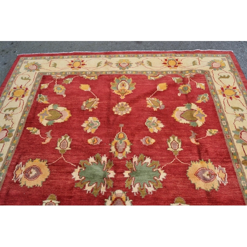 49 - Afghan Ziegler design carpet with an all-over palmette pattern on a rose ground with ivory ground bo... 