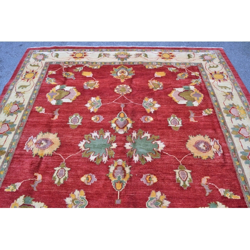 49 - Afghan Ziegler design carpet with an all-over palmette pattern on a rose ground with ivory ground bo... 