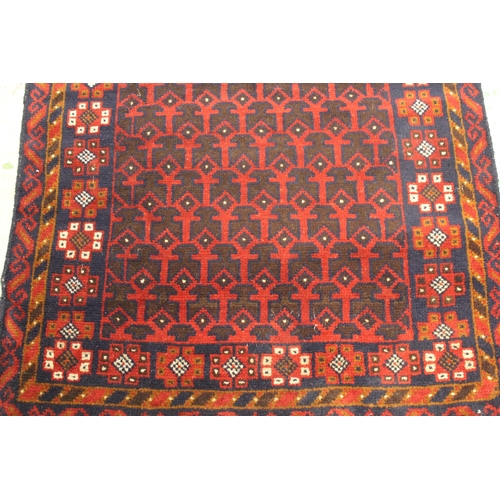 5 - Modern Afghan Belouch rug with an all-over stylised design in shades of deep red and dark blue, 200 ... 