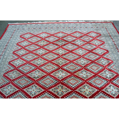 53 - Pakistan carpet of Turkoman design, with an all-over geometric pattern on a red ground with borders ... 