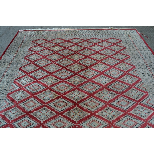 53 - Pakistan carpet of Turkoman design, with an all-over geometric pattern on a red ground with borders ... 