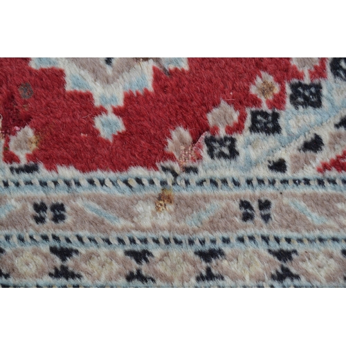 53 - Pakistan carpet of Turkoman design, with an all-over geometric pattern on a red ground with borders ... 