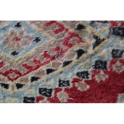 53 - Pakistan carpet of Turkoman design, with an all-over geometric pattern on a red ground with borders ... 