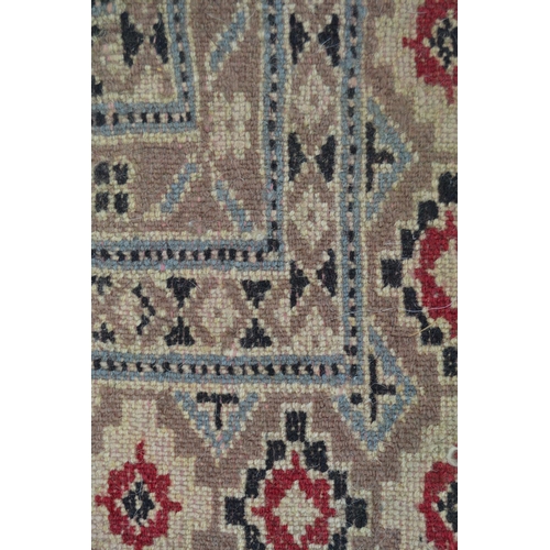 53 - Pakistan carpet of Turkoman design, with an all-over geometric pattern on a red ground with borders ... 