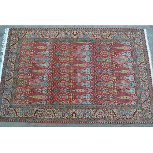 54 - Sparta carpet with all-over stylised floral and vase design on a pink ground