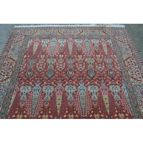 54 - Sparta carpet with all-over stylised floral and vase design on a pink ground