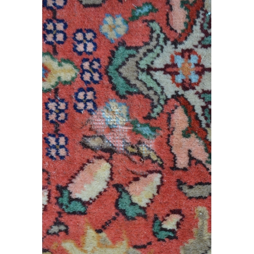 54 - Sparta carpet with all-over stylised floral and vase design on a pink ground