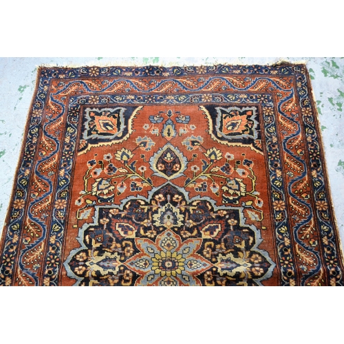 56 - Small Meshed rug with a medallion and floral design on a red ground with borders, 169cms x 110cms ap... 