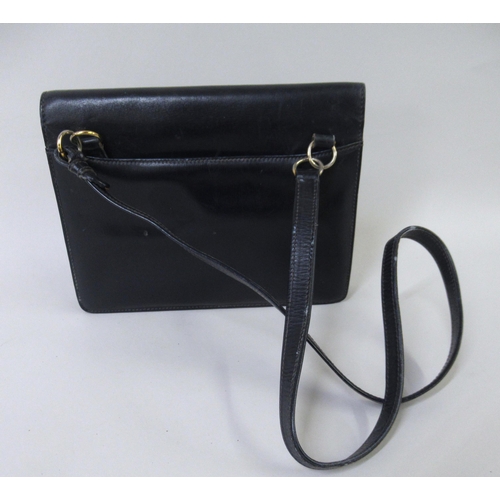 62 - Small ladies Gucci dark blue leather shoulder bag