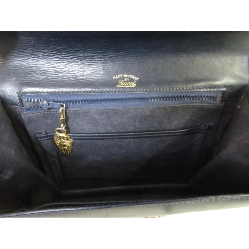 62 - Small ladies Gucci dark blue leather shoulder bag