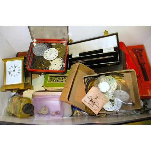 744 - Box containing a large quantity of various pocket watch parts and tools, also including a carriage c... 