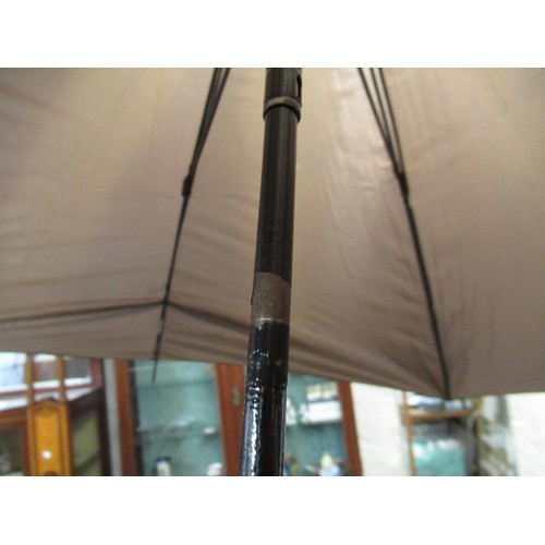 254 - Christian Dior umbrella, together with another umbrella