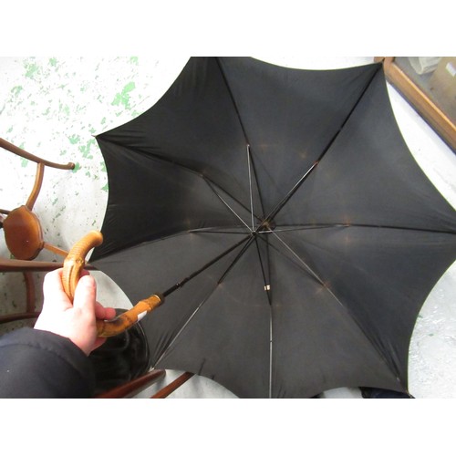 254 - Christian Dior umbrella, together with another umbrella