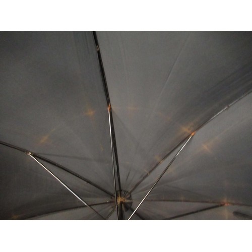 254 - Christian Dior umbrella, together with another umbrella