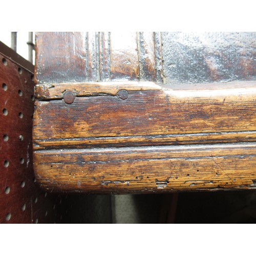 1446 - Small 17th Century oak coffer, the hinged three panel lid above a three panel front on stile support... 