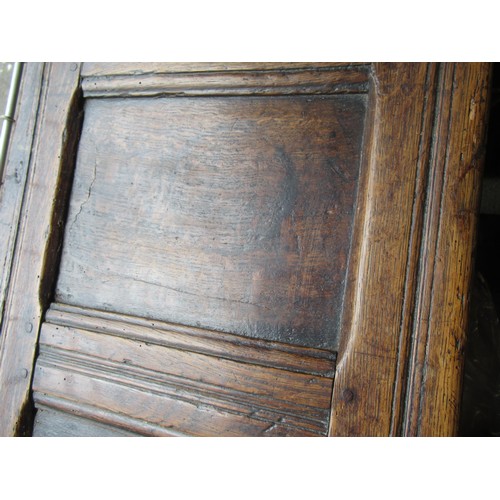 1446 - Small 17th Century oak coffer, the hinged three panel lid above a three panel front on stile support... 