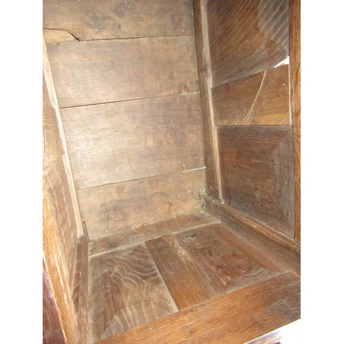 1446 - Small 17th Century oak coffer, the hinged three panel lid above a three panel front on stile support... 