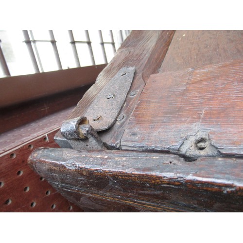 1446 - Small 17th Century oak coffer, the hinged three panel lid above a three panel front on stile support... 