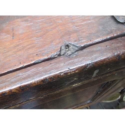 1446 - Small 17th Century oak coffer, the hinged three panel lid above a three panel front on stile support... 