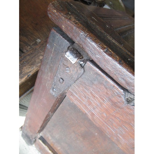 1446 - Small 17th Century oak coffer, the hinged three panel lid above a three panel front on stile support... 