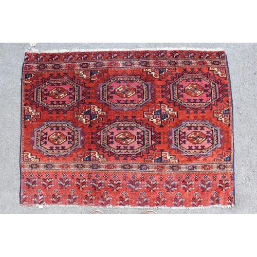10 - Small Turkoman tent bag with three rows of two gols on a wine ground with skirt panel, 111cms x 80cm... 