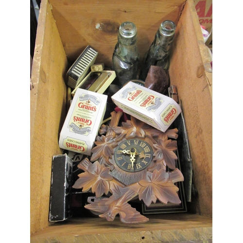 102 - Wooden box containing a collection of 
 miscellaneous items including a miniature cuckoo clock, play... 