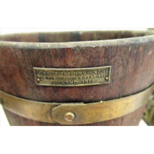 114 - Ship's brass mast head lamp, together with a teak and iron bound bucket constructed from timbers fro... 