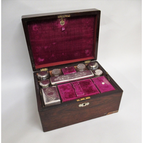 1246 - Victorian rosewood and mother of pearl inlaid dressing case, the hinged cover enclosing a fitted int... 