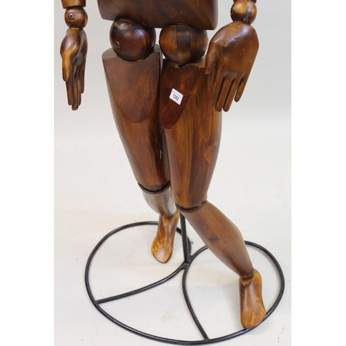 1252 - Artist's modern carved hardwood ley figure by Halfpenny Mannequins, mounted on a black painted metal... 