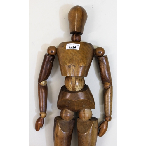 1253 - Artist's mid 20th Century carved hardwood ley figure, 65cms high overall approximately