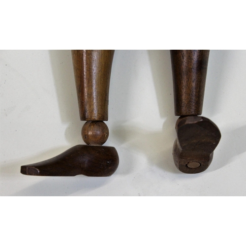 1253 - Artist's mid 20th Century carved hardwood ley figure, 65cms high overall approximately