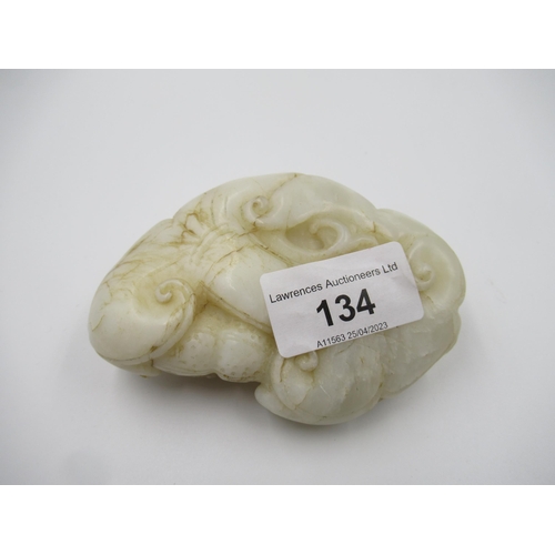 134 - 20th Century Chinese carved white jade figure of a dragon with further relief carving to the base, 1... 