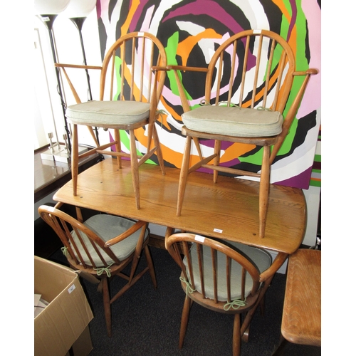 Ercol elm refectory table, 138cms x 68cms, together with four Ercol hoop back Windsor armchairs