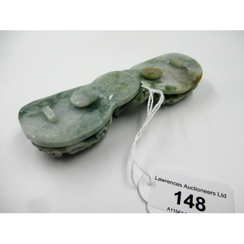 148 - 20th Century carved mottled pale green jade belt buckle in two parts, decorated in deep relief, 12.5... 