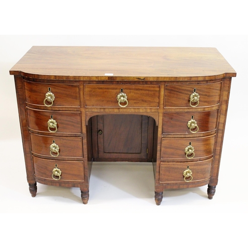 1559A - 19th Century mahogany bow fronted dressing table having an arrangement of nine drawers with brass ri... 