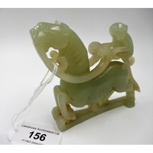 156 - Carved pale green jade group of a monkey riding a horse, 8.5cm x 9cm approximately