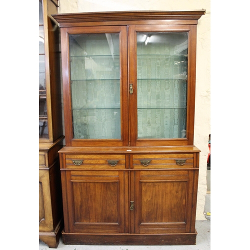 1561 - Late Victorian walnut bookcase with two glazed doors above two drawers and two panel doors, 126cms w... 