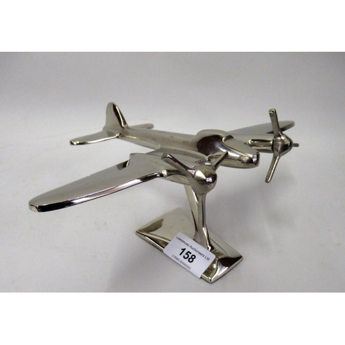 158 - Reproduction cast metal model of a twin propeller aircraft with integral stand