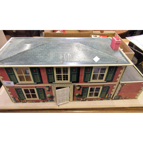 159 - Mid 20th Century tin plate doll's house together with a quantity of furniture and a small quantity o... 